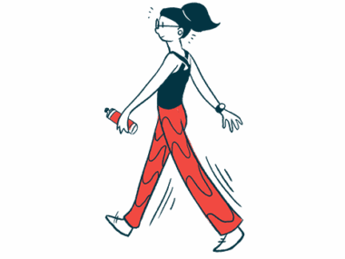 A woman, wearing red pants and a black shirt, walks while carrying a water bottle.