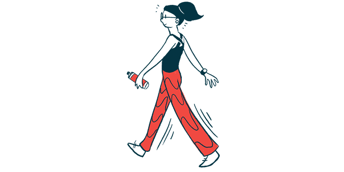 A woman, wearing red pants and a black shirt, walks while carrying a water bottle.