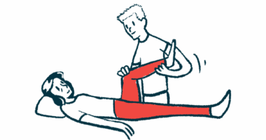 A physical therapist stands while stretching the leg of a person who is lying down.