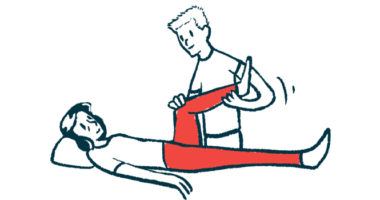A physical therapist stands while stretching the leg of a person who is lying down.