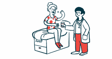 A woman sits on an exam table and takes medicine as a doctor stands next to her holding a cup of water.