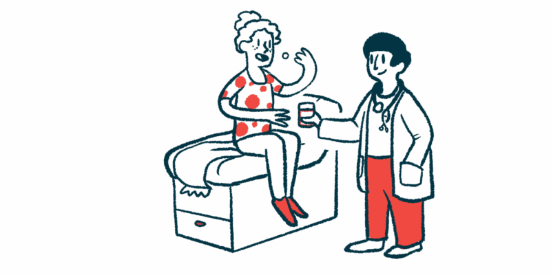 A woman sits on an exam table and takes medicine as a doctor stands next to her holding a cup of water.